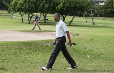 President Barack Obama walks away from the 18th hole while playing golf, Wednesday, Dec. 24, 2014, at Marine Corps Base Hawaii’s Kaneohe Klipper Golf Course in Kaneohe, Hawaii. (AP Photo/Jacquelyn Martin)