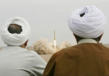 Iranian clerics watch the firing of missile of Shahab 3 during a war game near the holy city of Qom