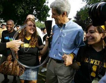 John Kerry with college students and a beer bong