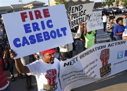 Protestors march Monday, June 8, 2015, during a demonstration  in response to an incident at a community pool involving McKinney police officers  in McKinney, Texas. (AP Photo/Ron Jenkins)