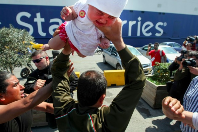 migrant_throwing_baby