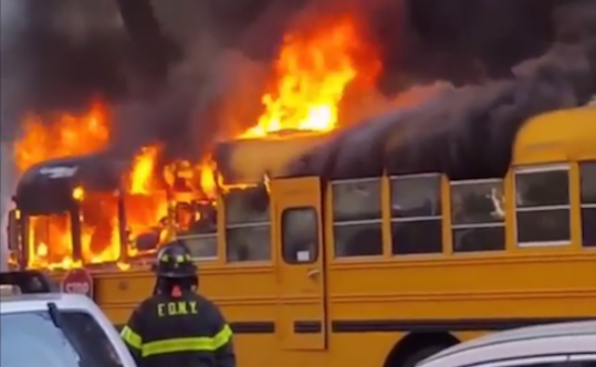 A school bus outside a Jewish school burning in the Crown Heights area of Brooklyn, New York, May 8, 2016.