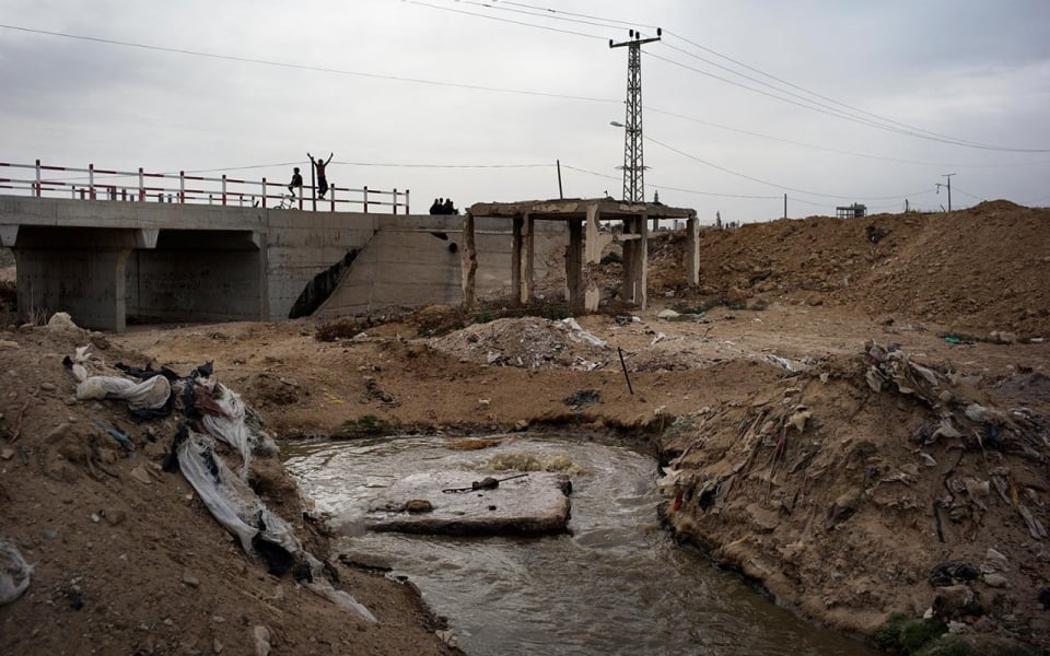 An open pool of sewage is seen in the garbage-filled Wadi Gaza area of the central Gaza Strip.