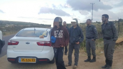 One of the youths arrested on the hilltop with his teffilin strapped on his shoulder.