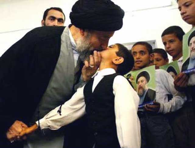 muhammad-baqir-al-hakim-kisses-boy-on-lips-on-arrival-to-supreme-council-najaf-iraq