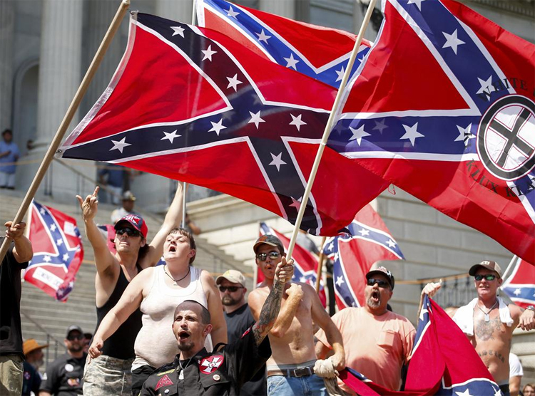 Real KKK racist Donald Trump supporters. Read the flag on the right.